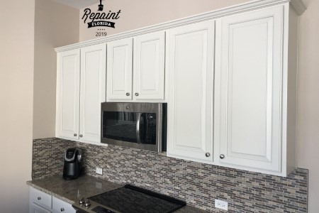 Cabinets white above stove